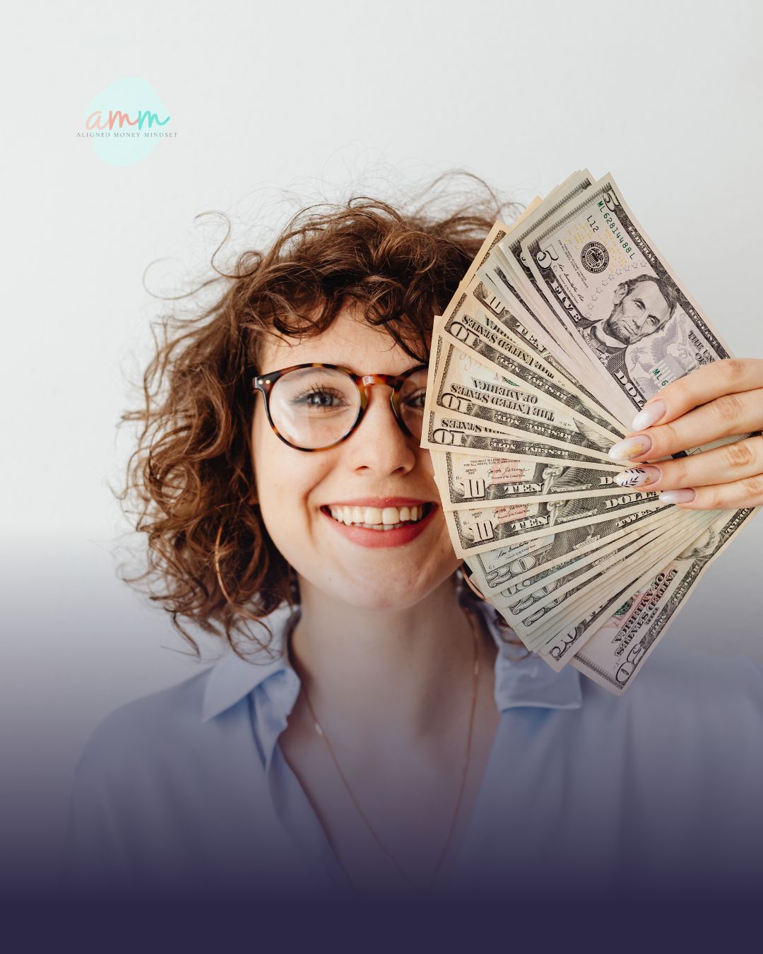 Smiling woman holding cash to symbolize confidence, financial clarity, and the impact of making empowered money decisions.