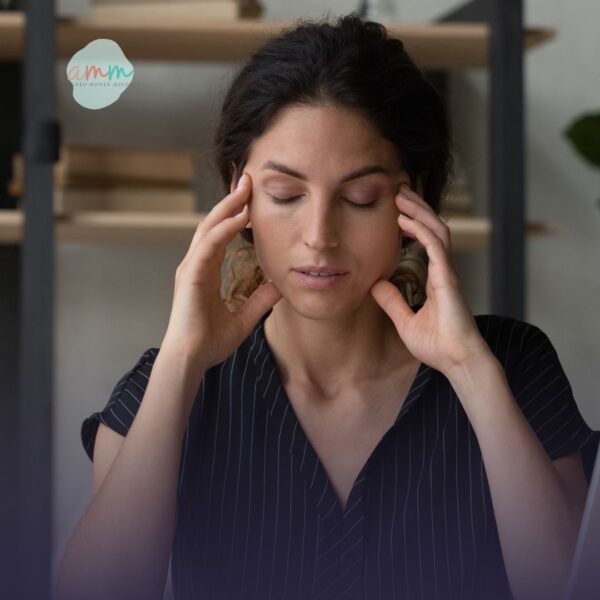 A first-gen woman sitting alone, symbolizing hyper-independence and money challenges